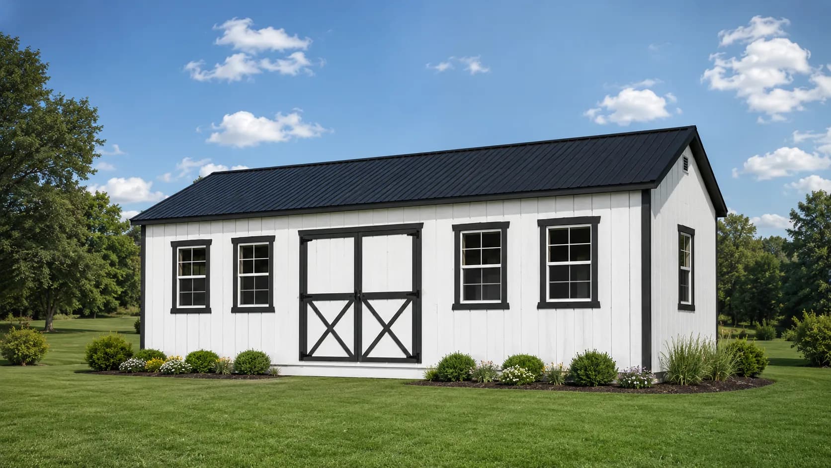 A finished white building freshly delivered and set on a level lot